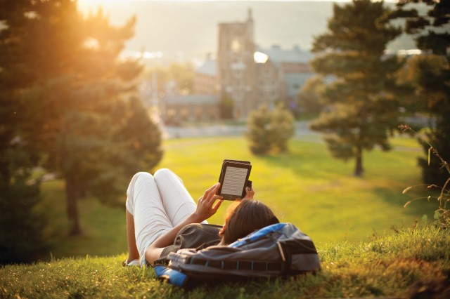 student reads on Libe Slope