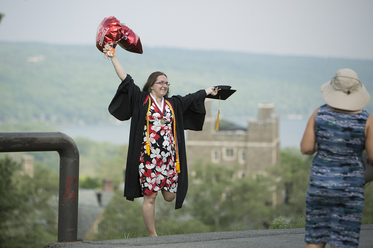 Graduate celebrating on slope