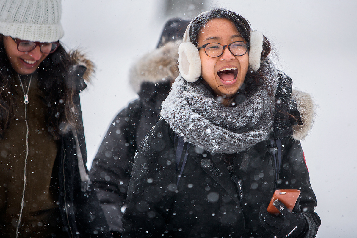 Student walks through storm