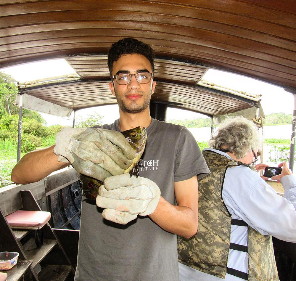 Sinan Kassam with oscar fish