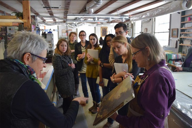 Margie Sutton of West Lake Conservators shows the Mellon course students painting repair and retouching